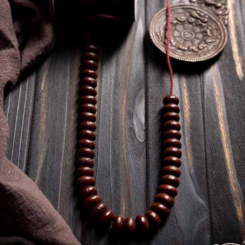 Buddhist 108 prayer mala showing natural variations in purple bodhi seed beads