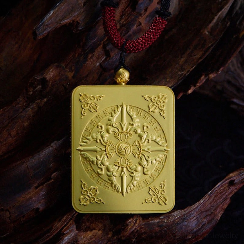 Embossed Buddhist mandala pendant with gold metal frame and intricate mandala pattern on dark wood surface