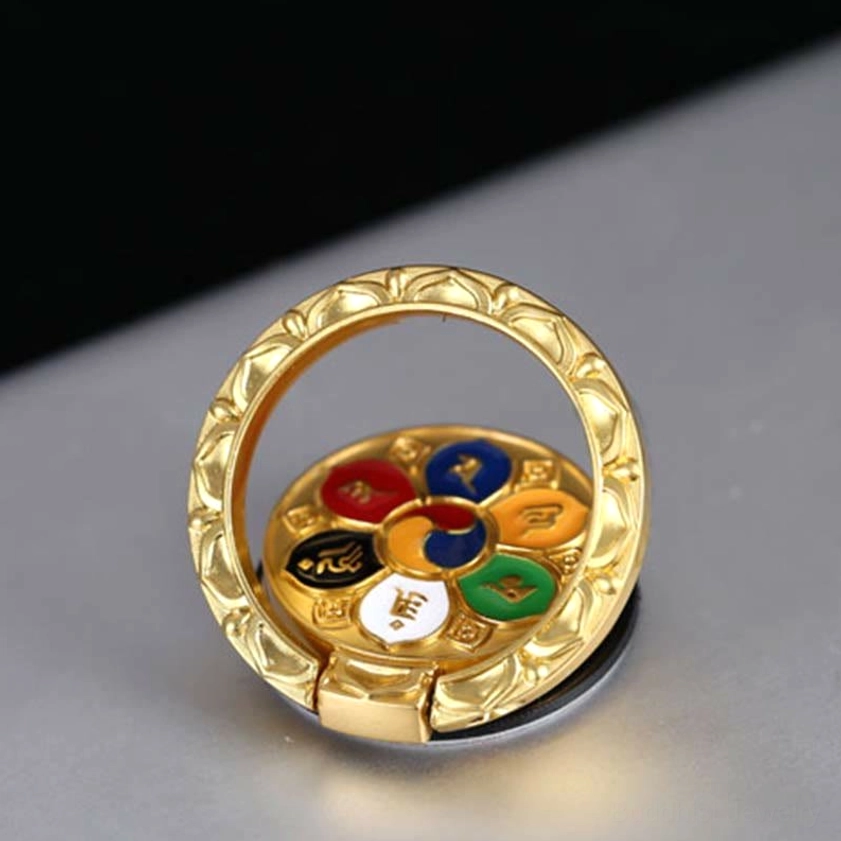 Tibetan Buddhist mandala phone ring holder with intricate enamel design in blue and gold, sacred geometry pattern