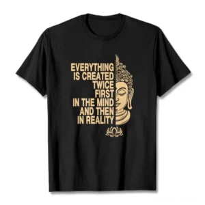 Black Buddhist manifestation t-shirt flat lay with gold Buddha head and lotus print on white background