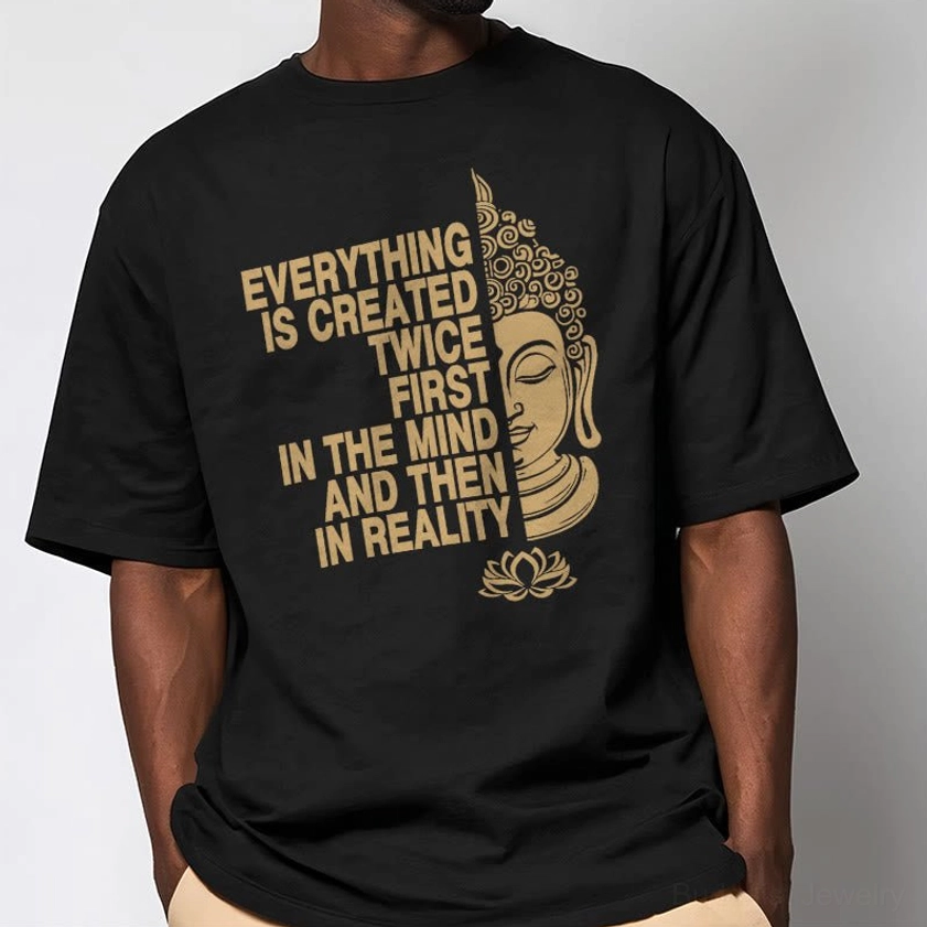 Man wearing black graphic t-shirt with Buddhist design and gold printed slogan