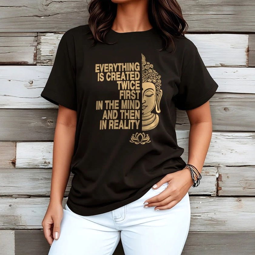Woman wearing black Buddhist t-shirt with white jeans and gold print design wooden wall background