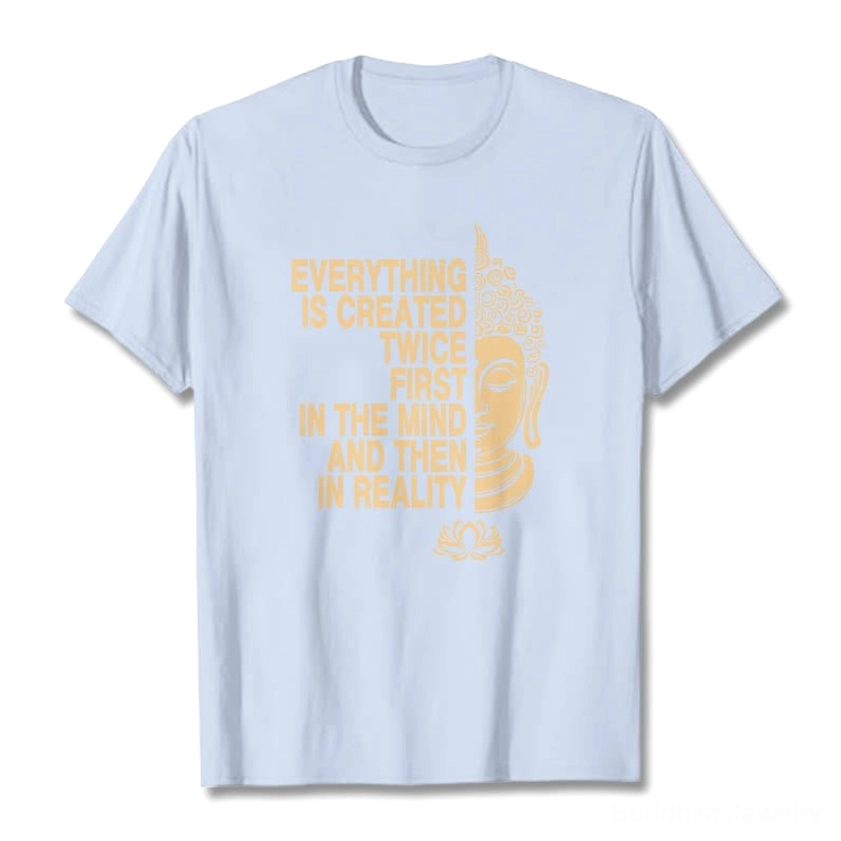 Light cyan Buddhist manifestation t-shirt showing gold printed Buddha lotus and intentional creation message