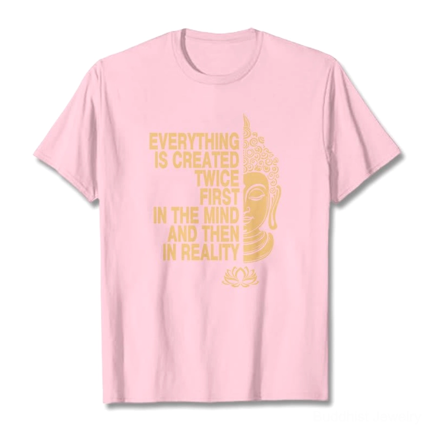 Light grey Buddhist graphic t-shirt flat lay with gold printed manifestation message and lotus art