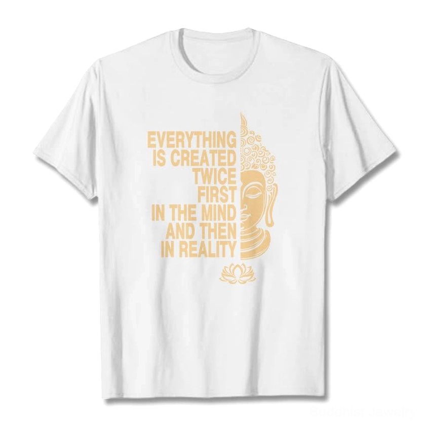 White Buddhist manifestation t-shirt flat lay with gold Buddha head lotus and slogan on white background