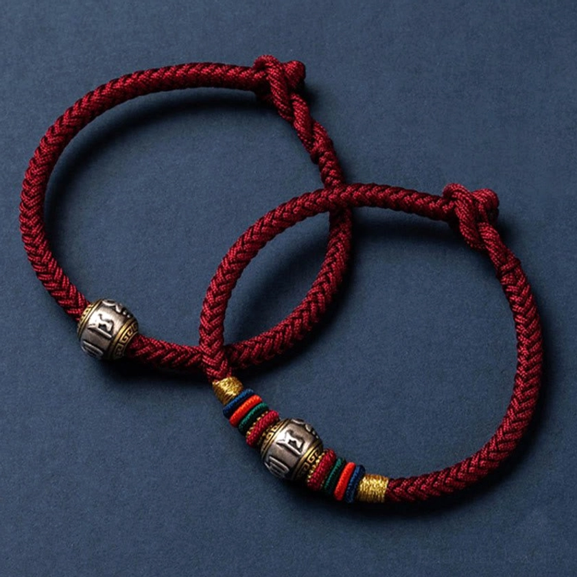 Buddhist mantra bracelet in multicolor braided rope with 925 sterling silver Om Mani Padme Hum charm and slip-knot fastener