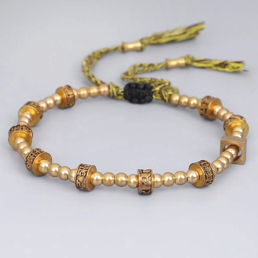 Six True Words mantra bracelet side angle showing bronze metal beads, smooth round beads, and black adjustment knot