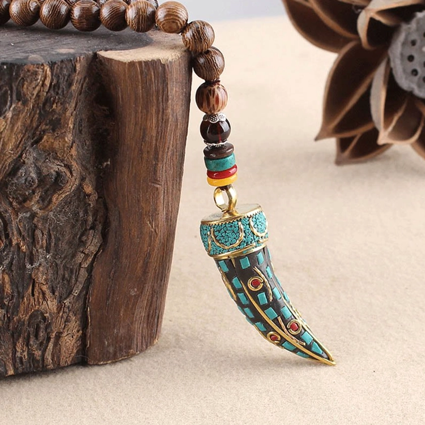 Buddhist necklace with sacred mantra beads and natural wood grain display