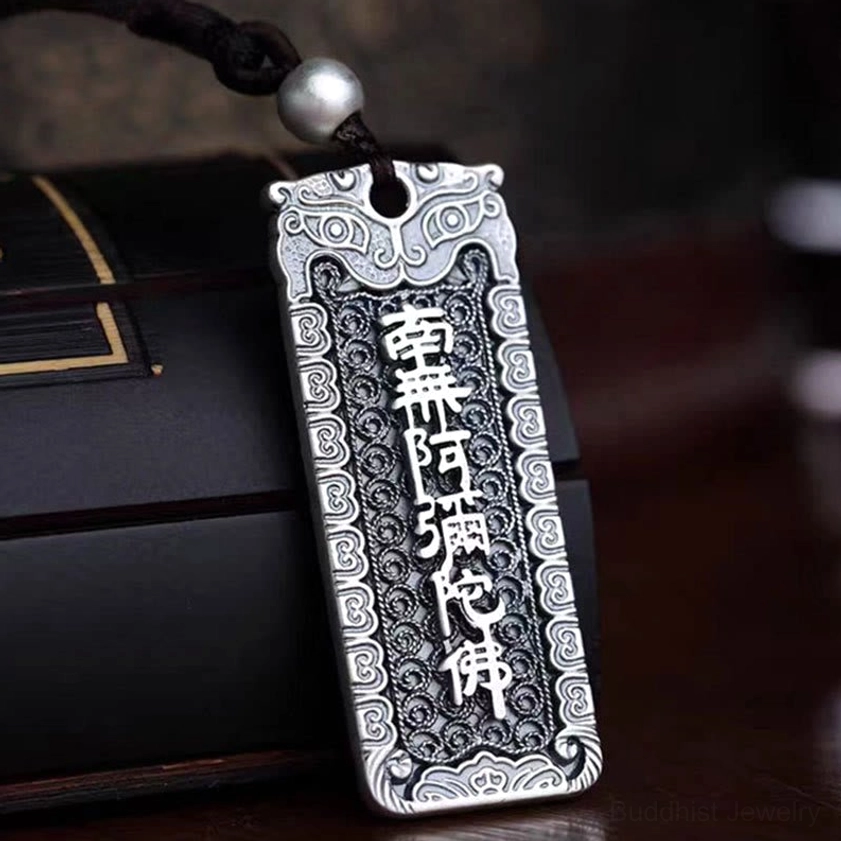 Buddhist mantra rectangular pendant with embossed Chinese scriptures and intricate floral border design on dark luxury background