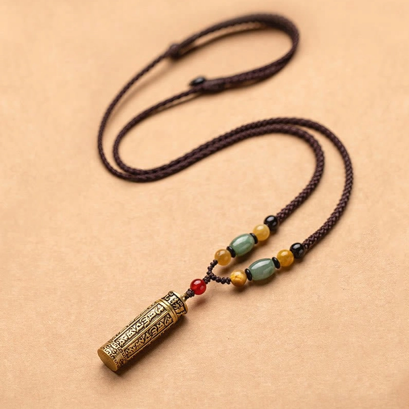 Buddhist cylinder mantra pendant necklace with bronze-gold engraved Om Mani Padme Hum, jade and red agate beads on braided brown rope