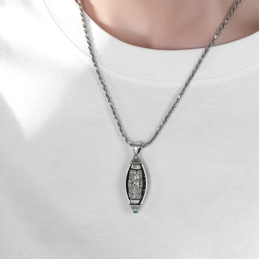 Buddhist protection necklace worn on model, casual daily wear under white t-shirt, silver twisted chain showing authentic wearability