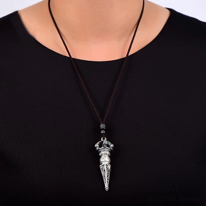 Om Mani Padme Hum Dorje Vajra pendant necklace worn around neck on black wax rope showing casual daily wear styling