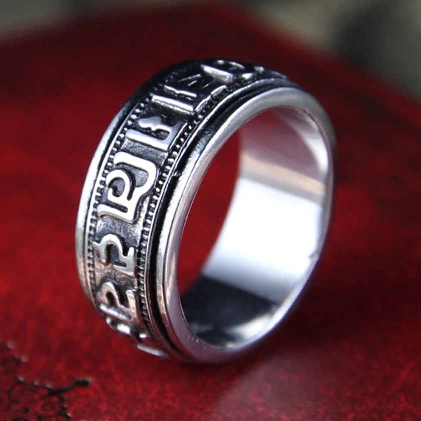 Sacred Buddhist mantra ring showing full band rotation and smooth spinning mechanism