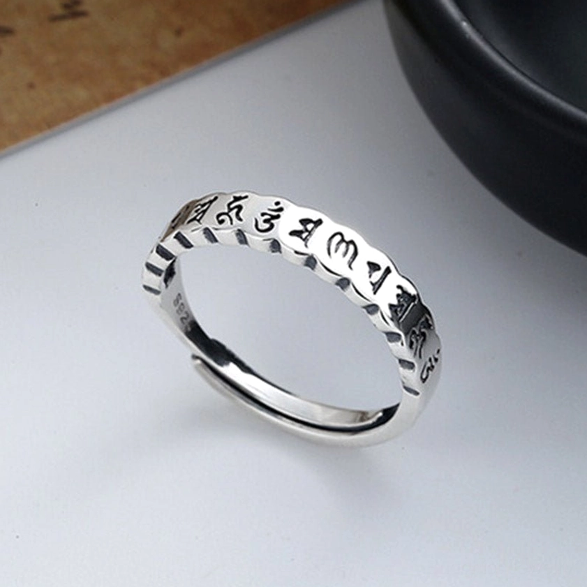 Buddhist mantra ring 925 sterling silver - side view showcasing detailed Sanskrit engraving and antique silver texture with open adjustable band
