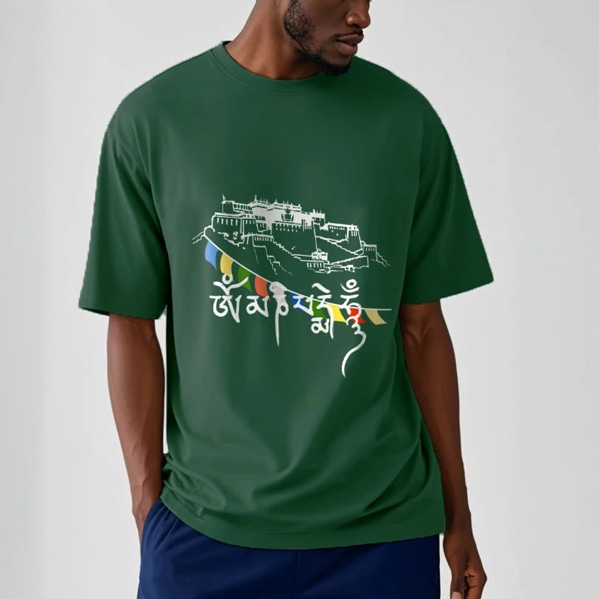 Male model wearing dark green Buddhist prayer flag t-shirt with Om Mani Padme Hum design, paired with navy blue bottoms