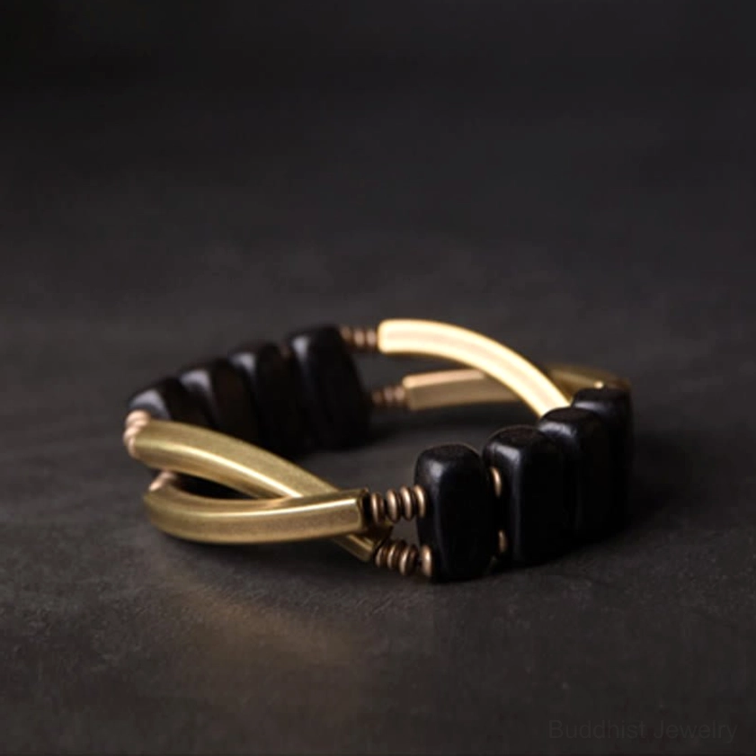 Ebony wood and brass Buddhist meditation bracelet for balance, protection, and spiritual wellness