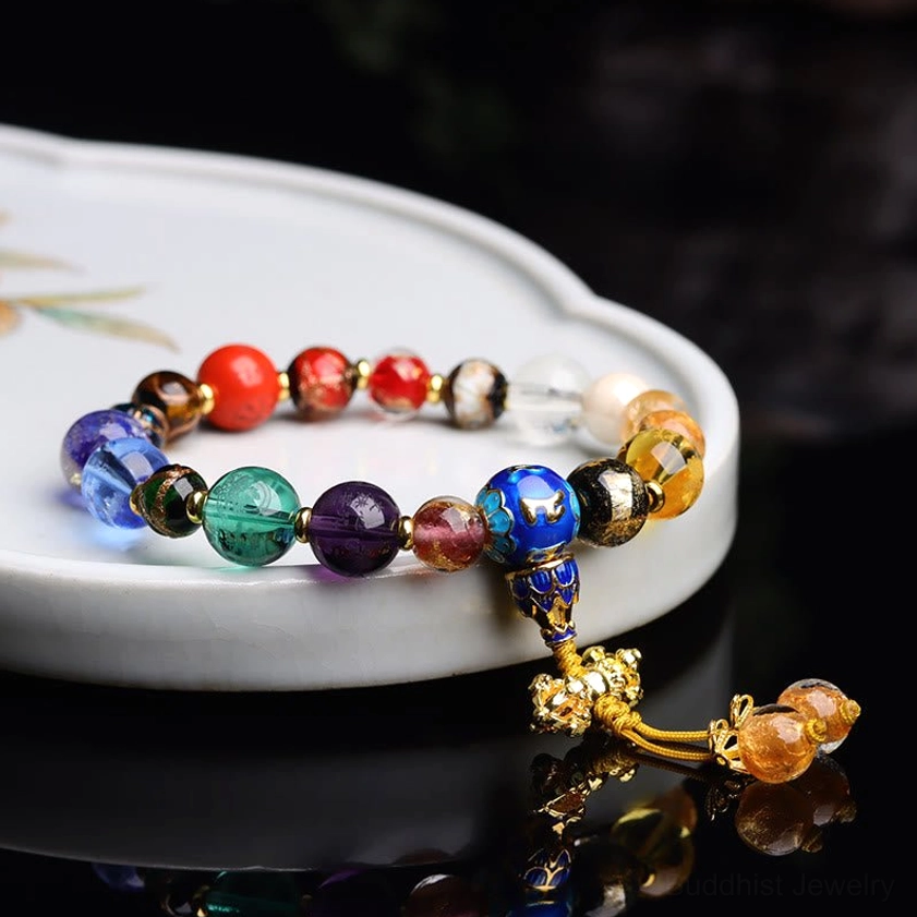 Buddhist meditation mala bracelet with incense ash liuli glass beads in multiple colors showing traditional 18-bead prayer strands
