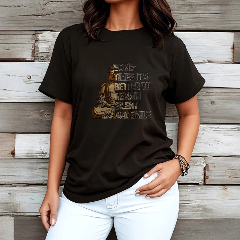 Female model wearing black Buddhist T-shirt with white denim jeans on wooden background, relaxed spiritual style