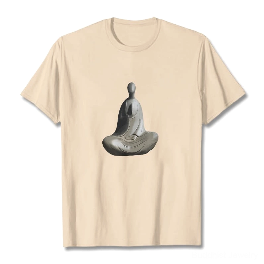 Cream beige formless Buddha cotton t-shirt flat lay showing matte fabric texture and seated Buddha artwork