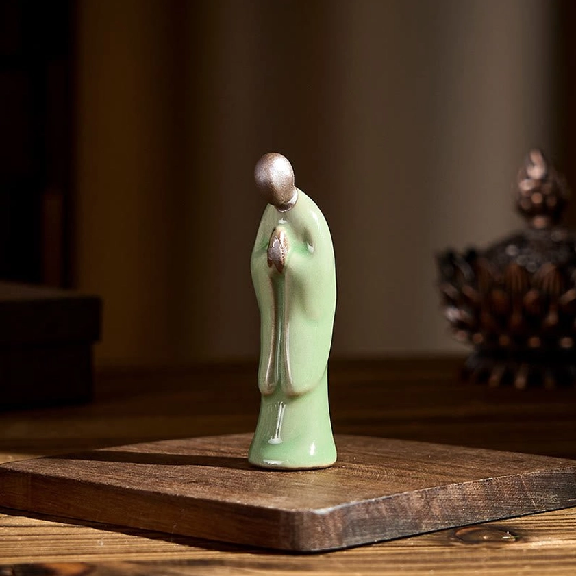 Buddhist monk ceramic figurine contemplation pose spiritual mindfulness anchor