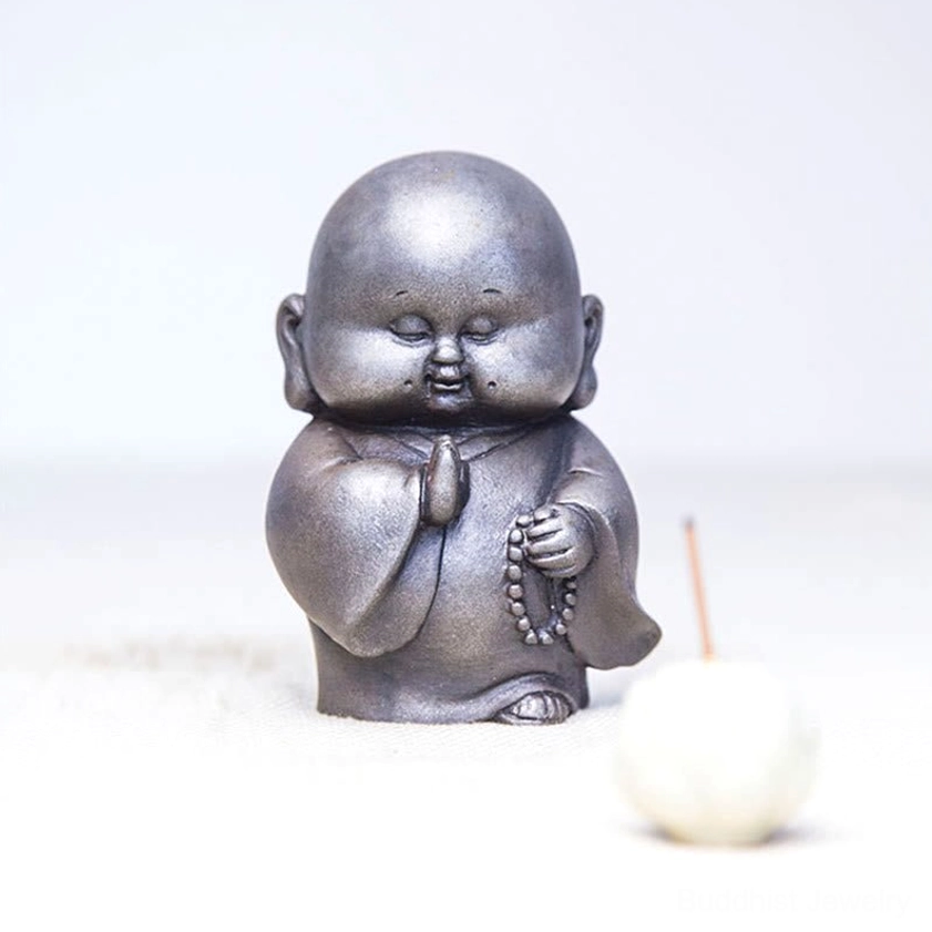Handcrafted Buddhist monk statue showing back angle and detailed robe sculpting with aged finish