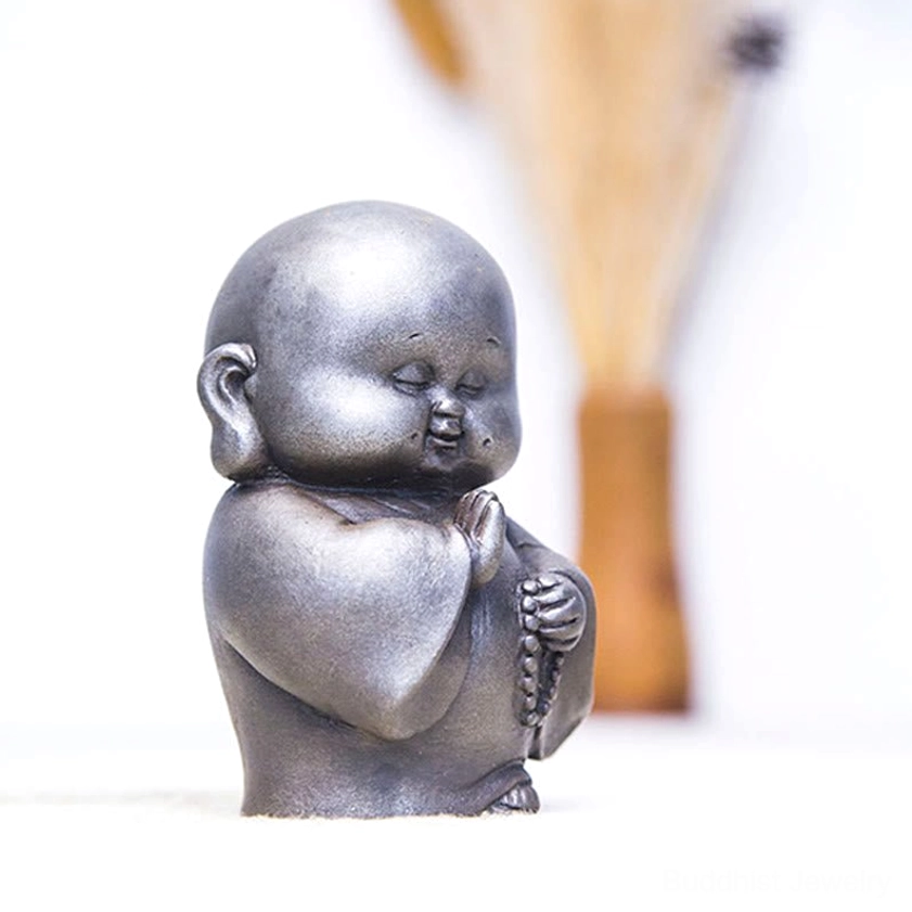 Buddhist monk ornament resin statue with matte texture and rust accents creating vintage temple aesthetic