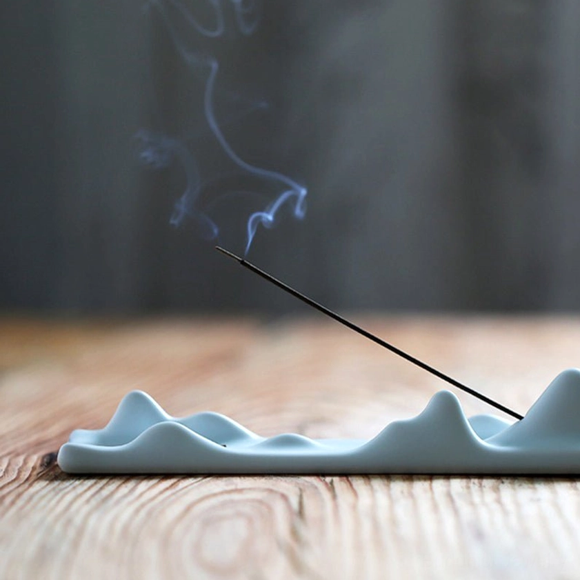 Buddhist incense holder mountain design with sacred geometry and spiritual symbolism