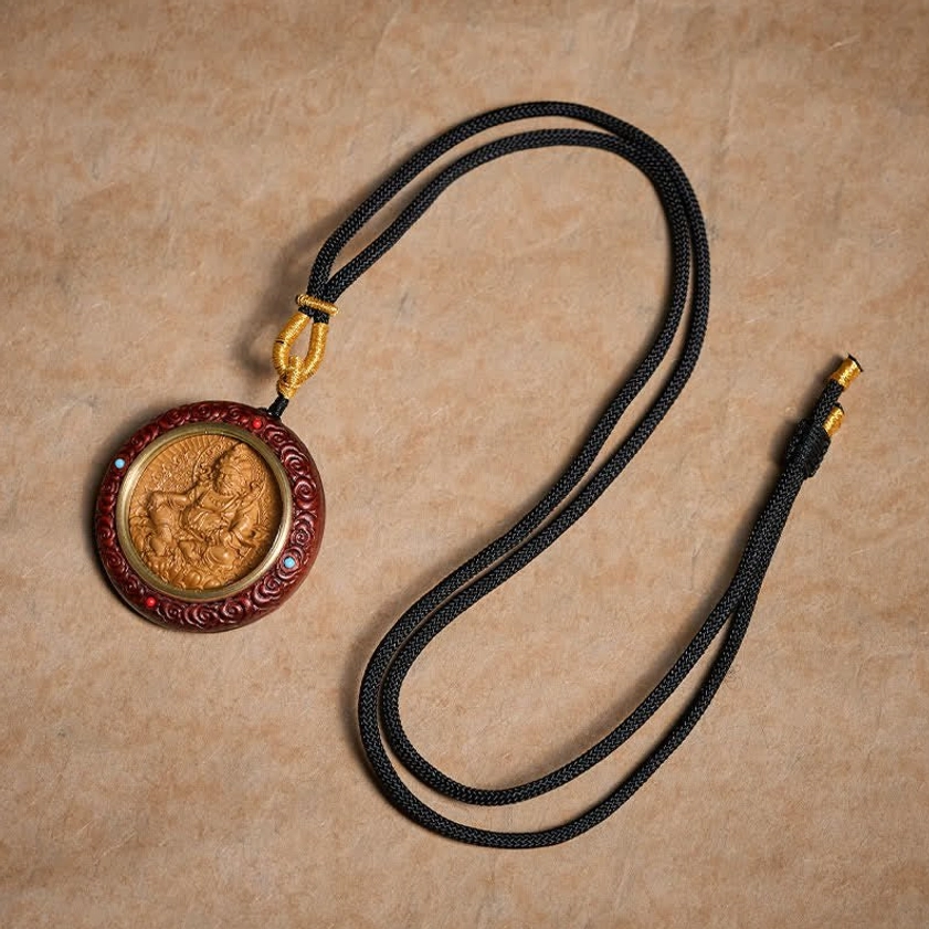 Full red sandalwood Buddhist necklace flat lay with braided black rope and gold metal clasp