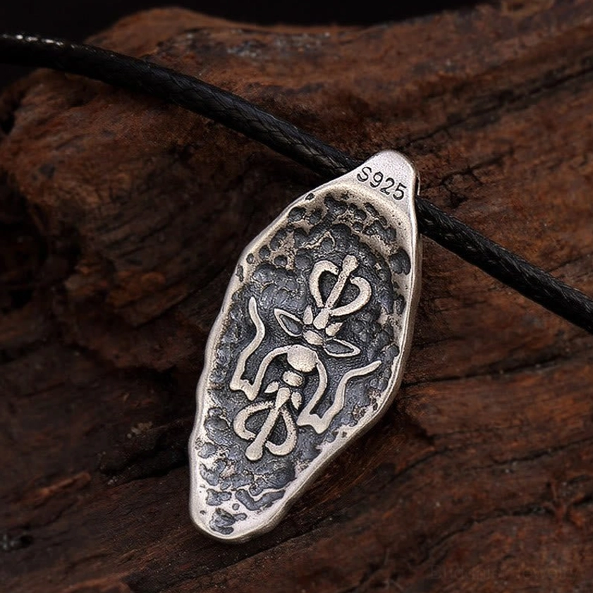 Buddhist mantra silver pendant necklace front oblique angle, clear Om Mani Padme Hum text engraving with distressed metal surface finish