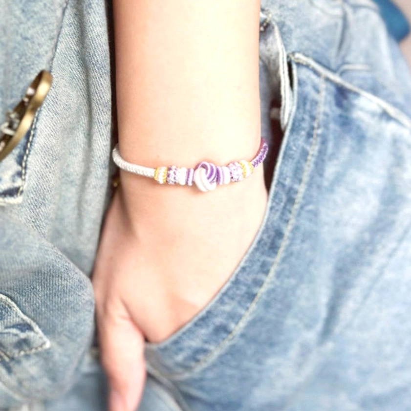 Buddhist eight-thread peace knot bracelet lifestyle shot showing spiritual protection and mindfulness jewelry