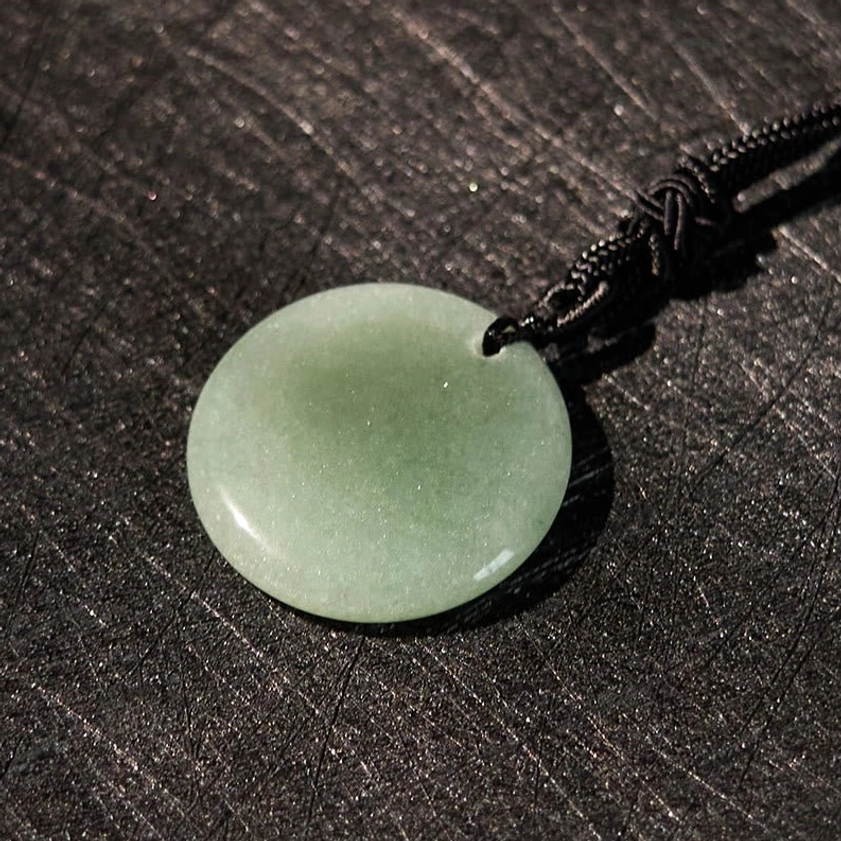 Multi-stone Buddhist pendant collection showing different crystal color options available