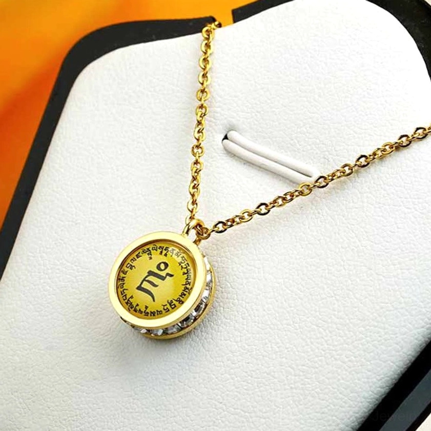 Buddhist necklace in gift box - compact pendant with delicate gold chain ready for gifting