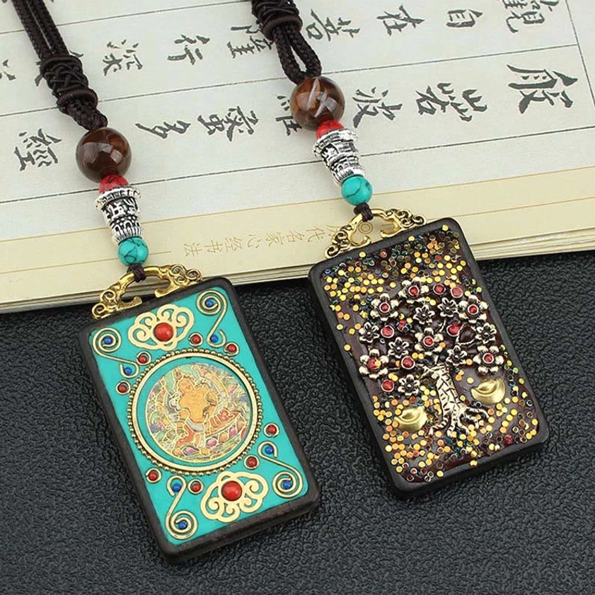 Buddhist wealth thangka pendant necklace worn - top-down view with turquoise and brown decorative beads