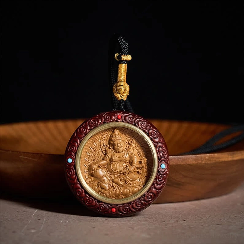 Red sandalwood Buddhist prosperity pendant side view showing carved cloud pattern frame and gold-toned metal ring