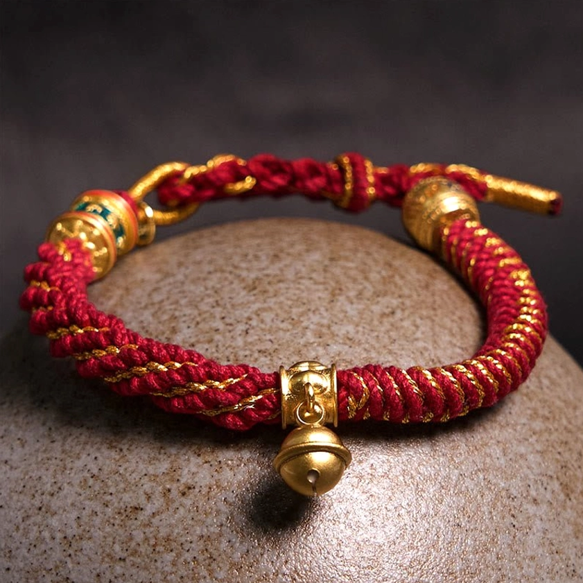 Buddhist prayer string bracelet with adjustable fit, gold hardware, and sacred protective pendants