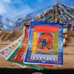 Buddhist prayer flag garland 5m five elements windhorse overhead view with multicolor flags on wooden table