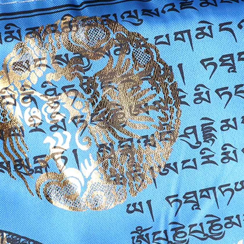 Detailed close-up of blue buddhist prayer flag with intricate gilded windhorse dragon and deity motifs surrounded by tibetan sutras