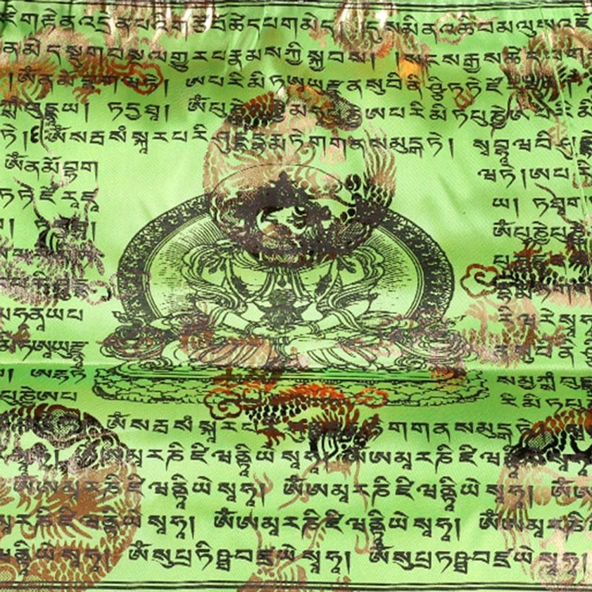 Detailed close-up of green buddhist prayer flag with black tibetan sutras and gilded dragon and buddha patterns
