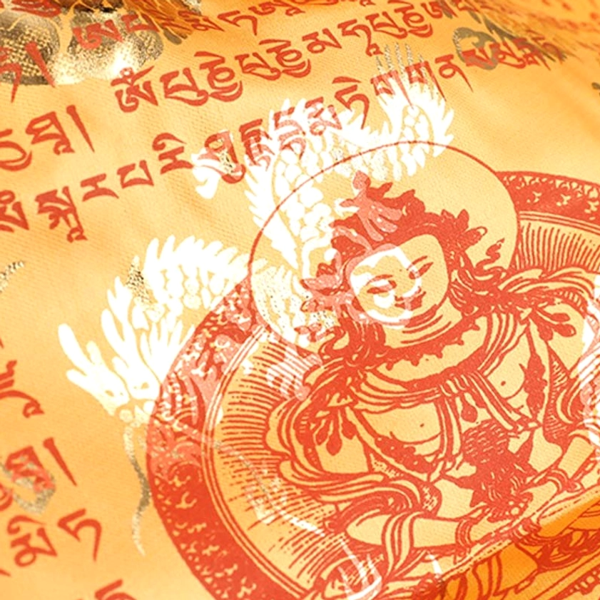 Yellow buddhist prayer flag displaying traditional five element earth symbol with tibetan mantras and spiritual motifs