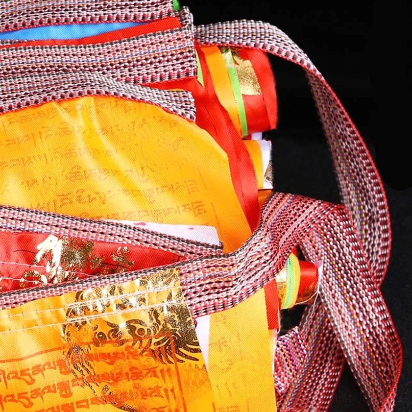 Complete set of five color buddhist prayer flags showing all elements arranged in traditional spiritual sequence