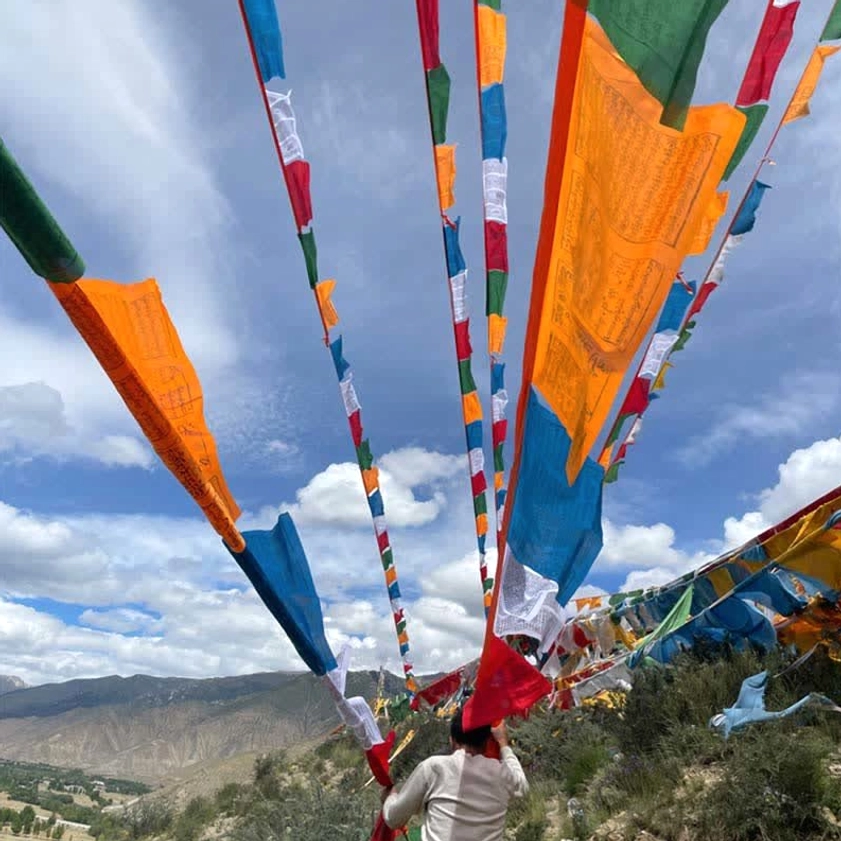 Buddhist prayer flags handprinted with sacred mantras and scriptures detail