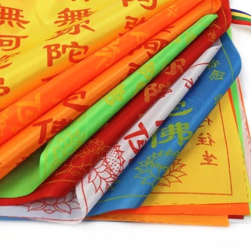 Buddhist prayer flags in natural outdoor environment, demonstrating spiritual transformation and wind-carried blessings practice
