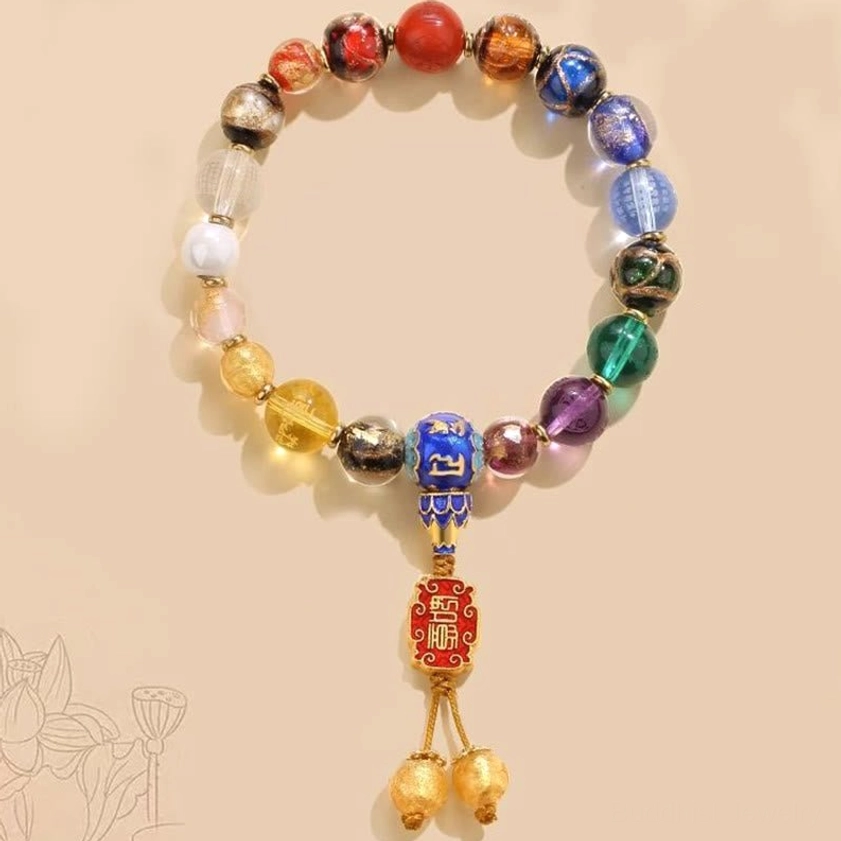 Buddhist 18-bead prayer mala with colorful incense ash liuli glass beads, blue mantra bead, and red pendant with golden bells on lotus pattern background