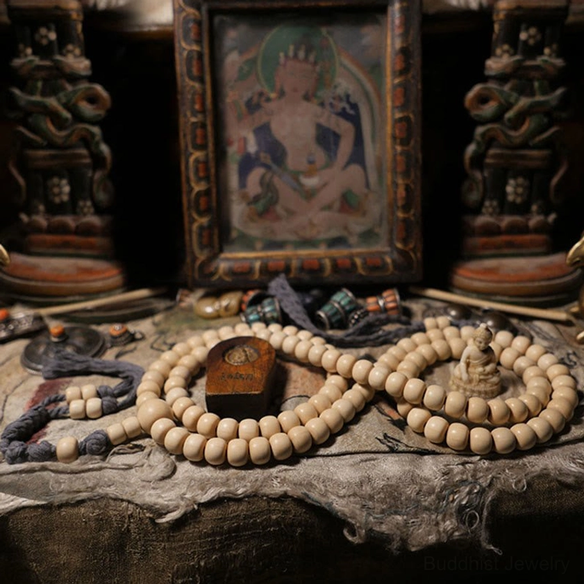 Two handcrafted 108 bead Buddhist prayer mala bracelets with creamy wooden beads and matching tassels