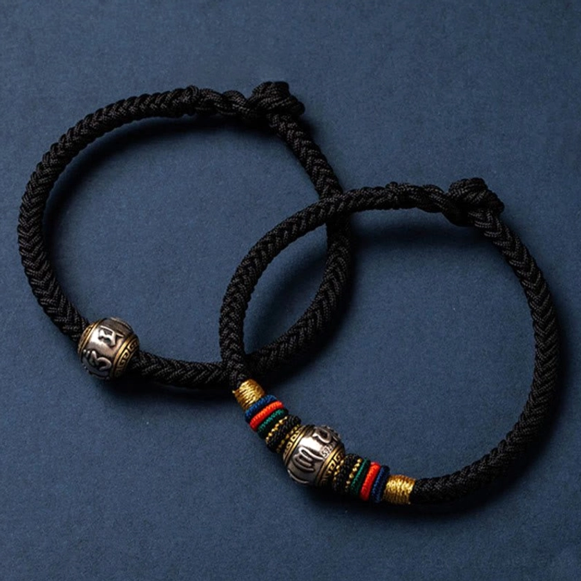 Buddhist prayer and protection bracelet with colorful weave pattern, silver charm, and adjustable King Kong knot closure