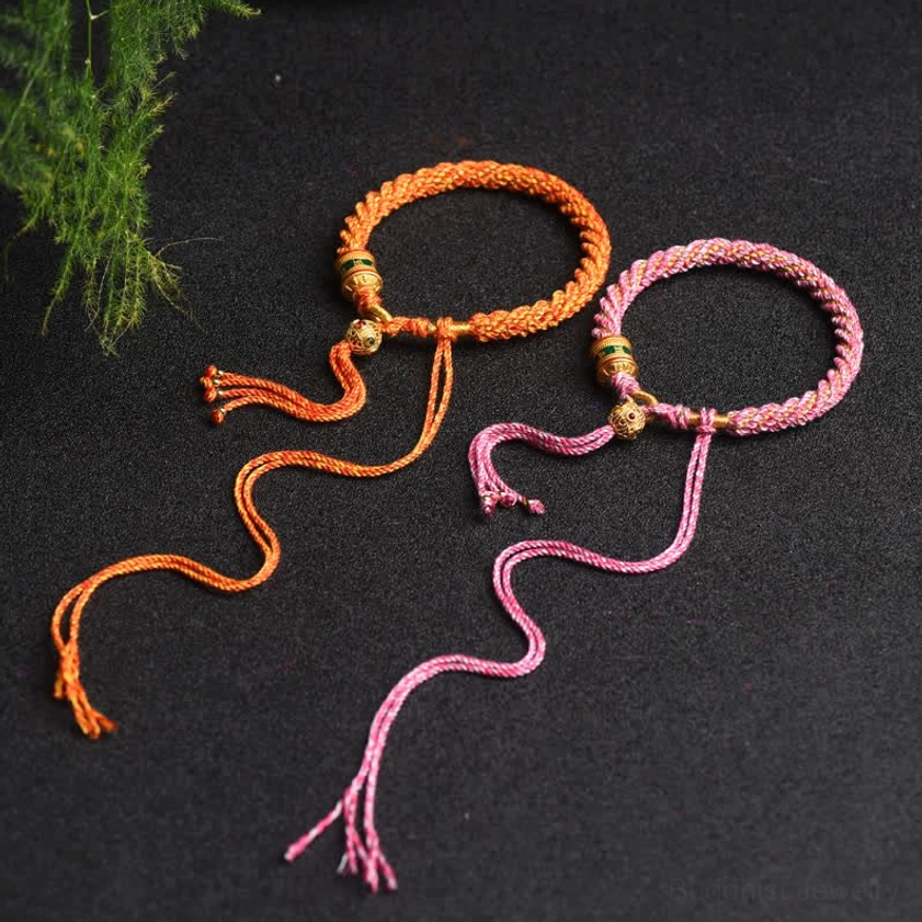 Buddhist prayer wheel braided lucky bracelet featuring sacred charm beads and natural fiber construction