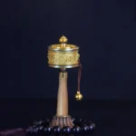 Authentic copper Buddhist prayer wheel with Om Mani Padme Hum mantra and brass bell, handheld design for meditation