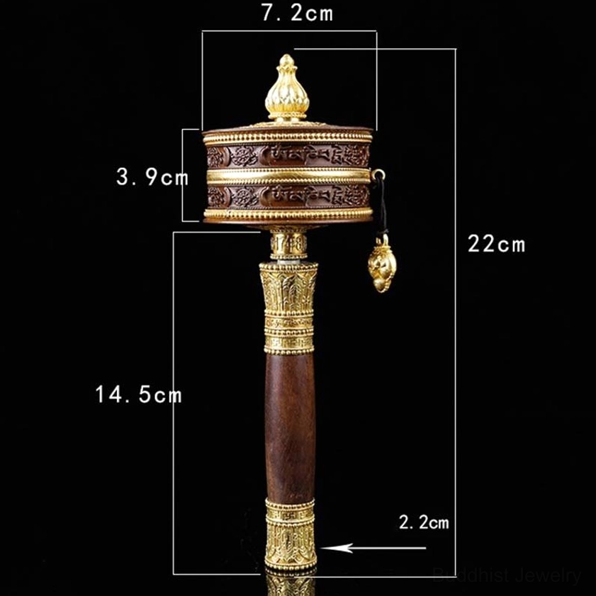 Size comparison of small and large Buddhist prayer wheels showing scale and design variations