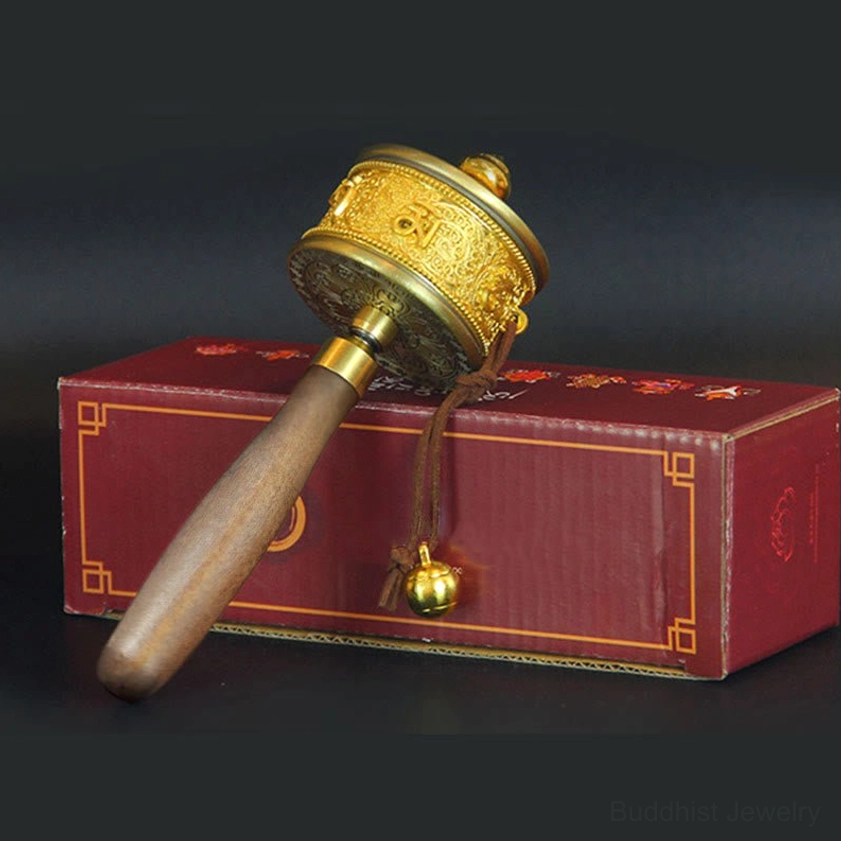 Traditional Buddhist prayer wheel demonstrating six true words mantra for meditation and spiritual practice