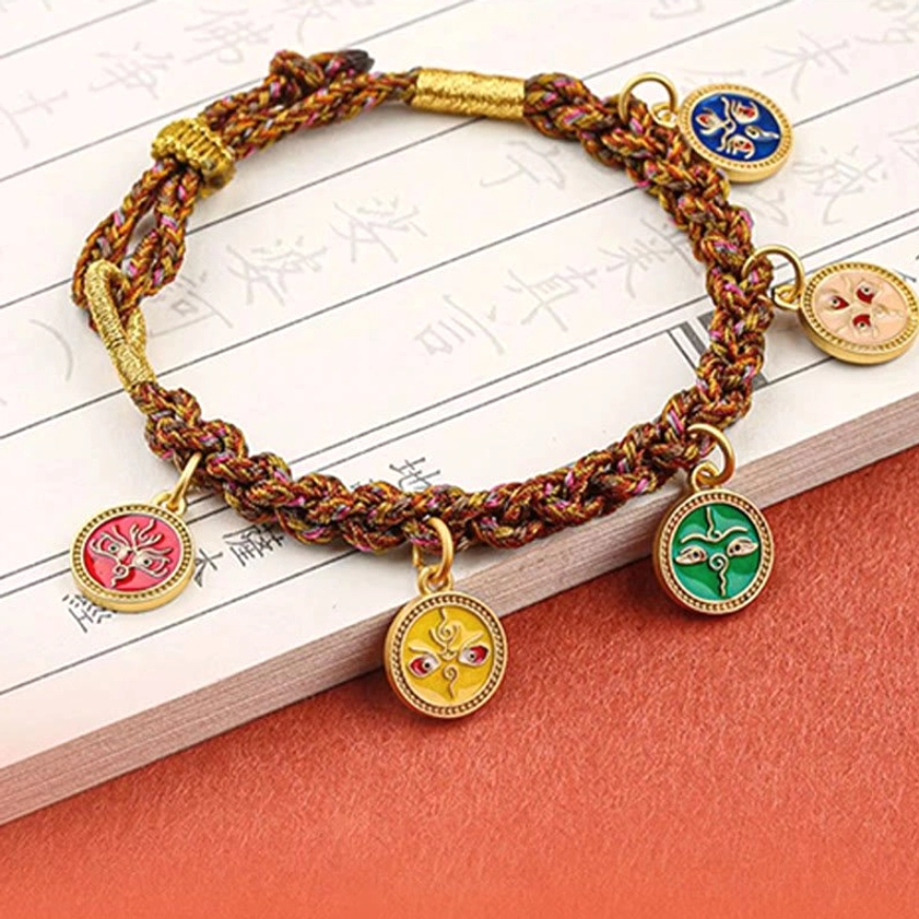 Five wealth deities bracelet on vintage calligraphy background displaying distinct deity motifs and braided rope